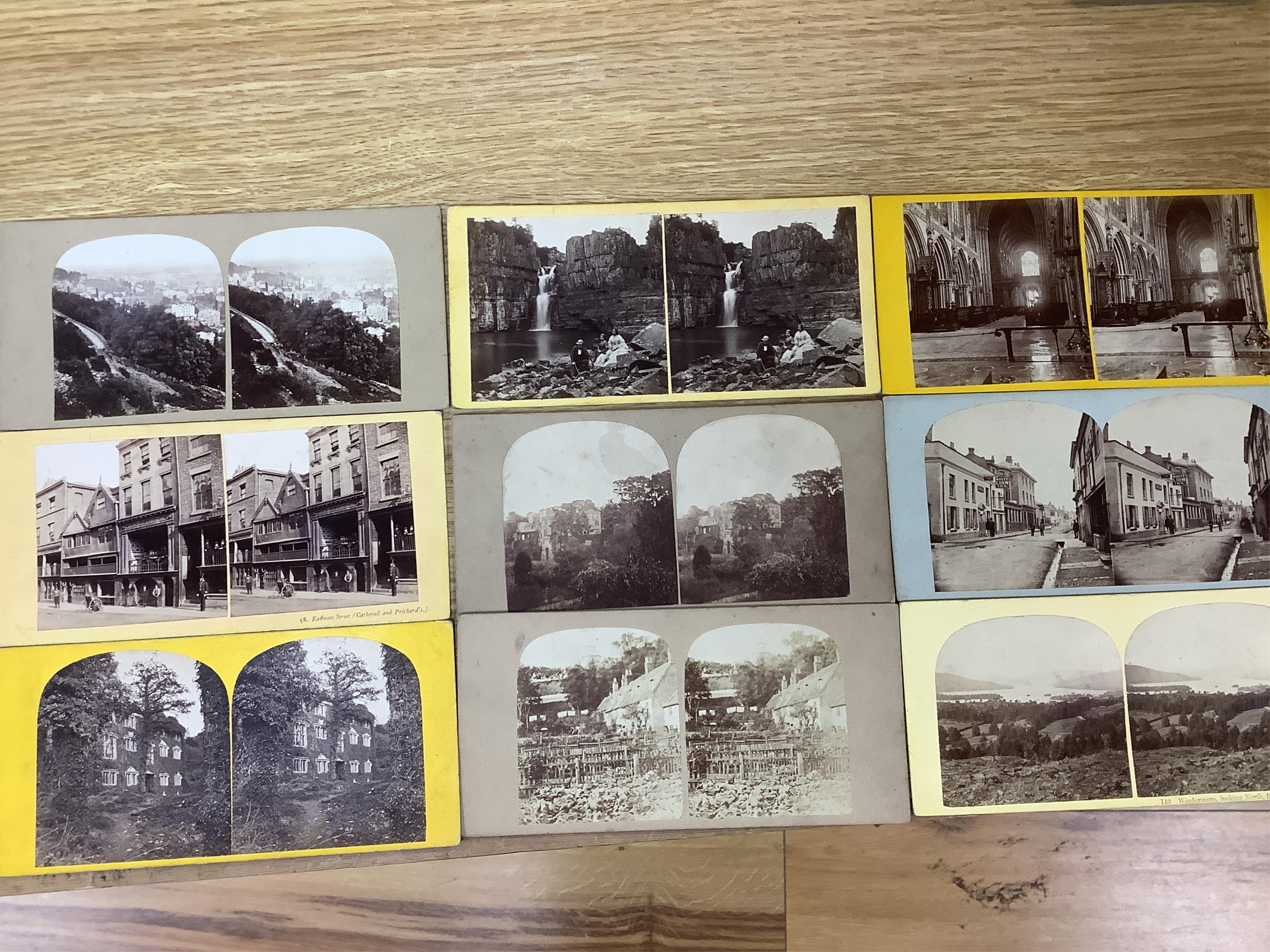 A late 19th century cased stereoscopic viewer together with topographical and other cards. Condition - fair